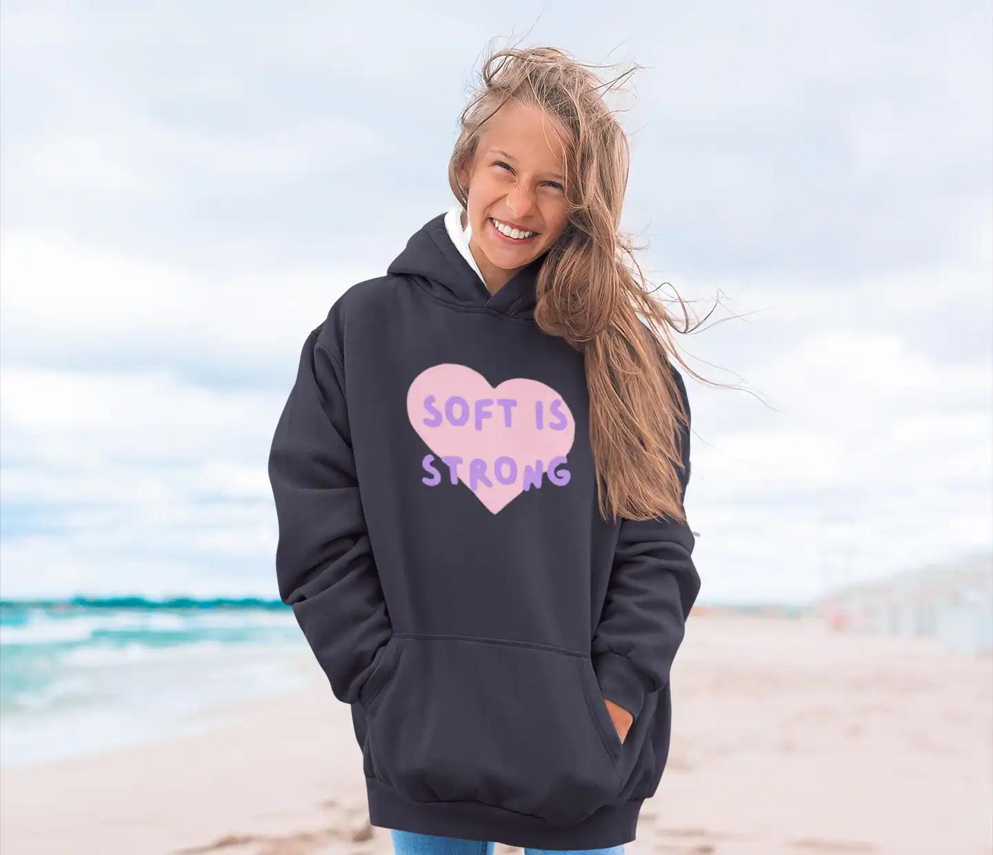model wearing katseye soft is strong hoodie